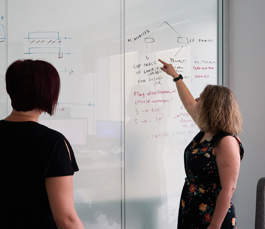 Female engineers reviewing software architecture